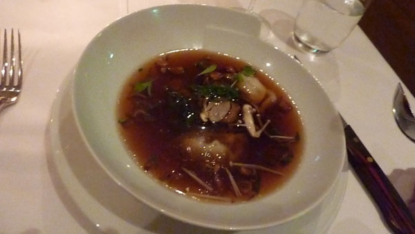 Peking duck consommé with duck dumplings and mushrooms